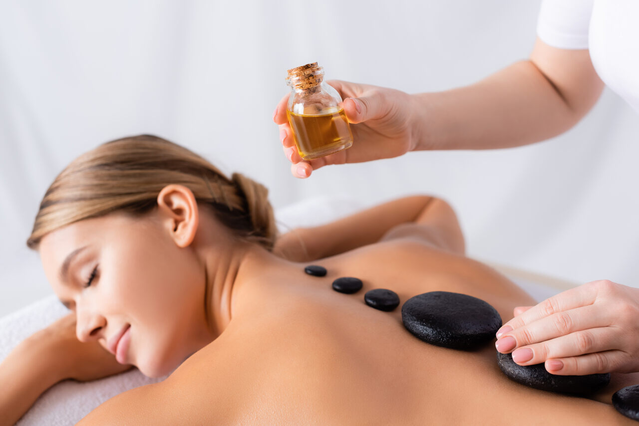 a woman having a hot stone massage