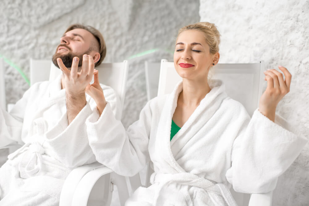 people relaxes in salt cave therapy and improves their energy